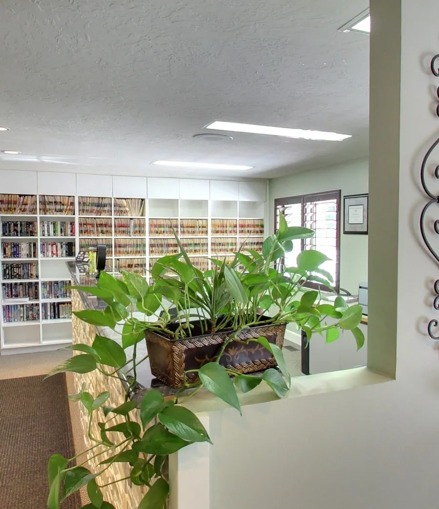 The corridor and front desk at Draper Parkway Dental, with patient files on the shelves.